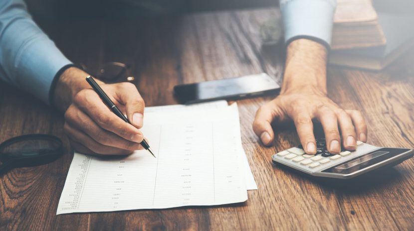 Man doing a Lemon law buyback calculation