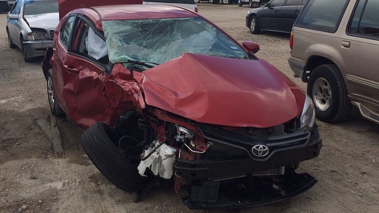 Many broken cars after a traffic accident in the parking lot of a